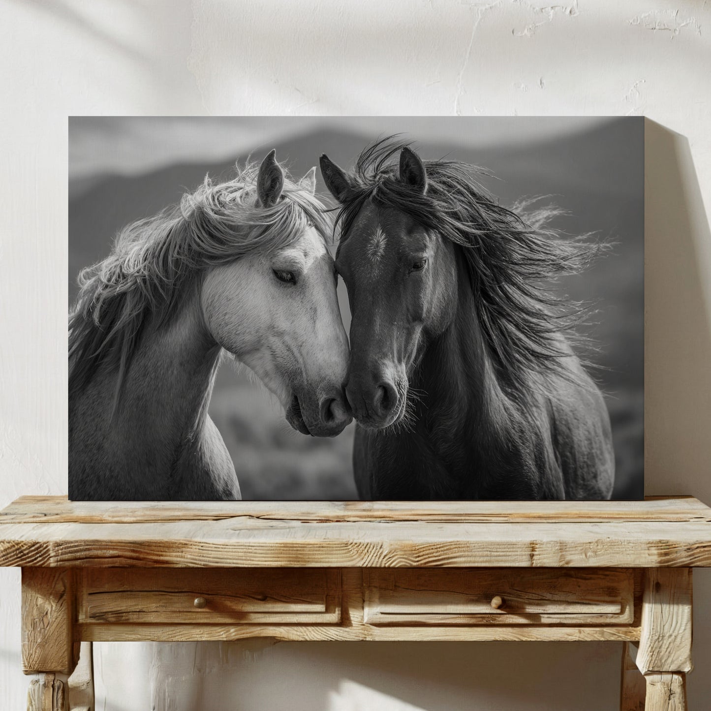Black and white photo of two horses on a wooden table