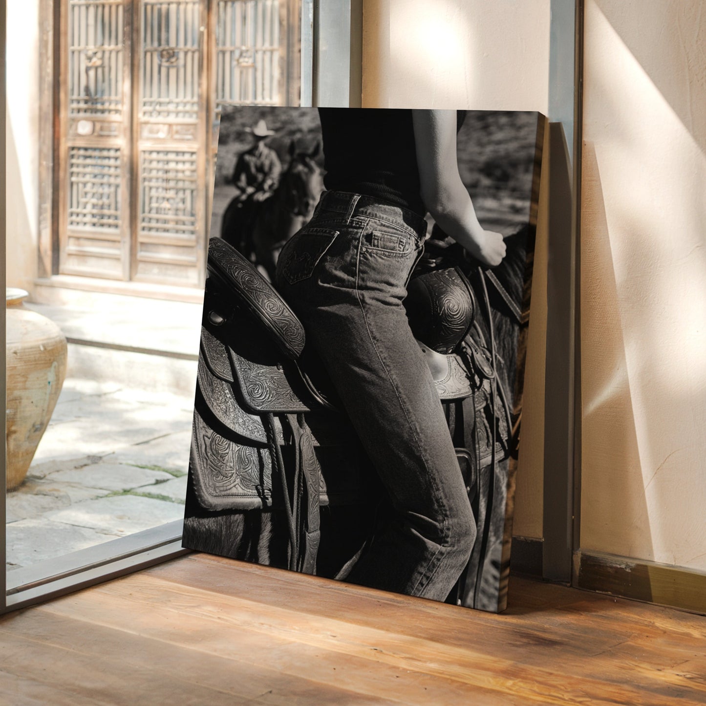 Framed black and white photograph leaning against a wall with a traditional Japanese house in the background.