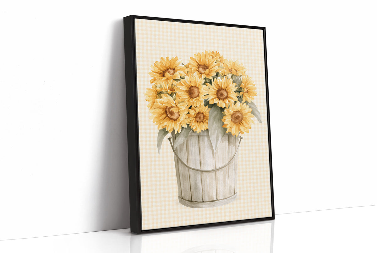 A Bucket of Sunlight Kept Indoors, a bouquet of yellow sunflowers and small blooms in a white metal pail, painted on a fine grid ground in gold, cream and sage, as a framed canvas in a black frame