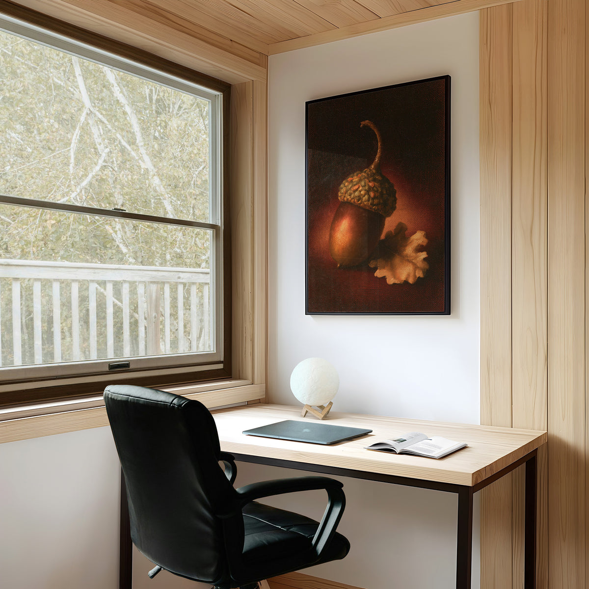 A Single Acorn in Candlelight, one acorn resting beside a curled oak leaf on a dark brown ground, lit from one side and painted in chestnut, amber and deep shadow, on a study wall above a writing desk and a black desk chair