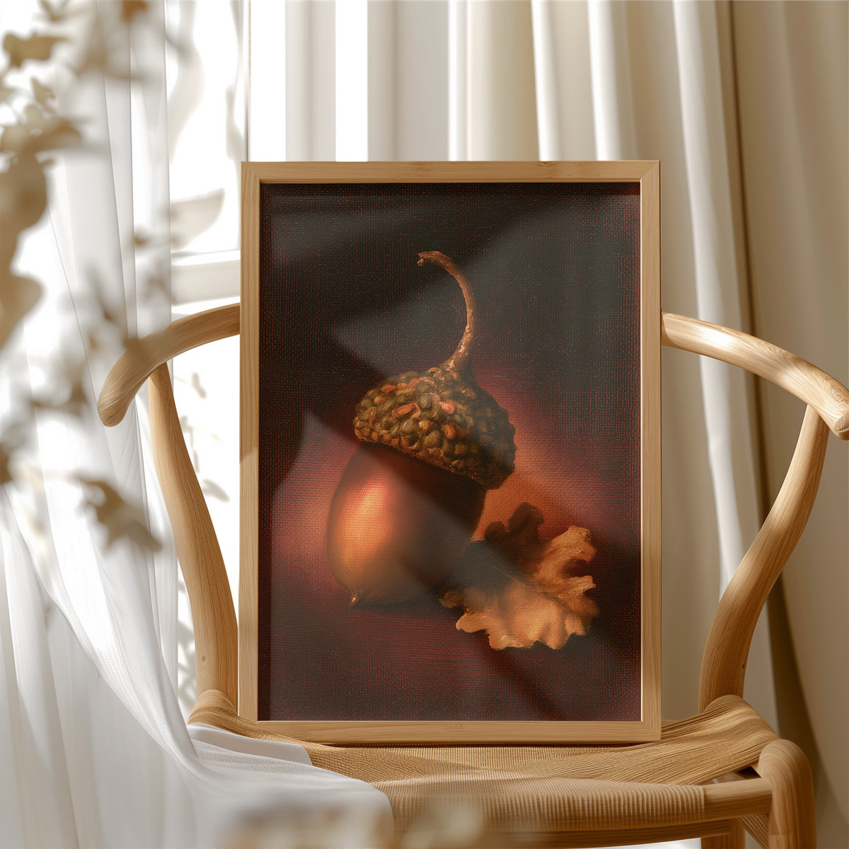 A Single Acorn in Candlelight, one acorn resting beside a curled oak leaf on a dark brown ground, lit from one side and painted in chestnut, amber and deep shadow, in a wood frame beside a wicker chair by a sunny window
