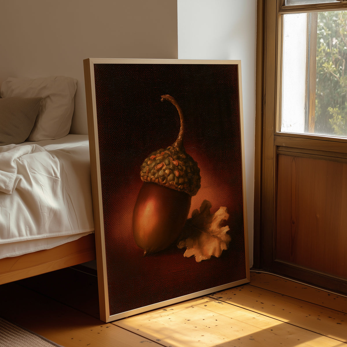 A Single Acorn in Candlelight, one acorn resting beside a curled oak leaf on a dark brown ground, lit from one side and painted in chestnut, amber and deep shadow, leaning on a wood floor in a bedroom beside white linen bedding