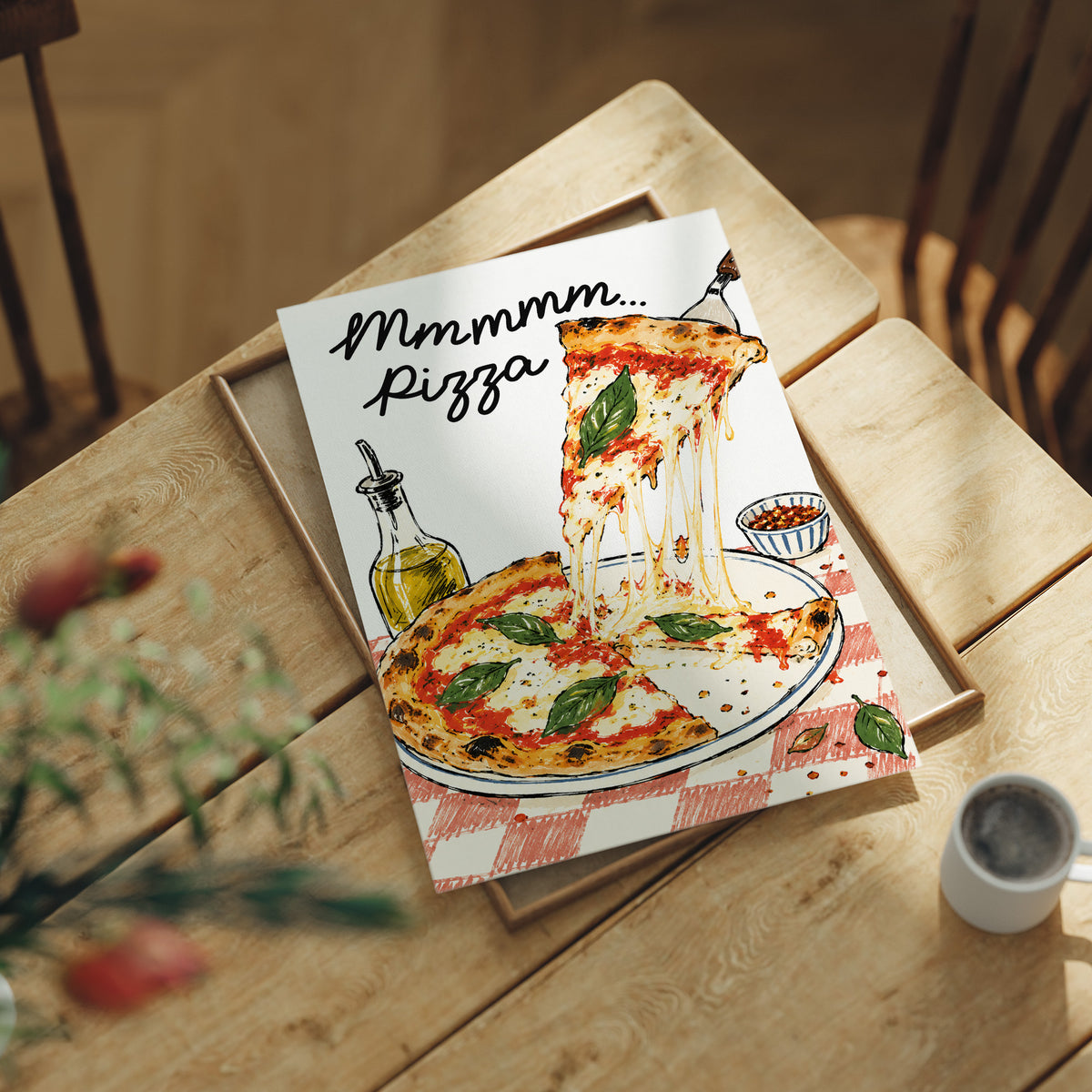 A Slice of Happiness Hangs Here, a slice of pizza lifting from a plate with a long strand of melted cheese, basil and tomato on top, the lettering Mmmmm in black script above and Pizza in red block letters below, lying flat on a light wood table beside a coffee cup and red berries