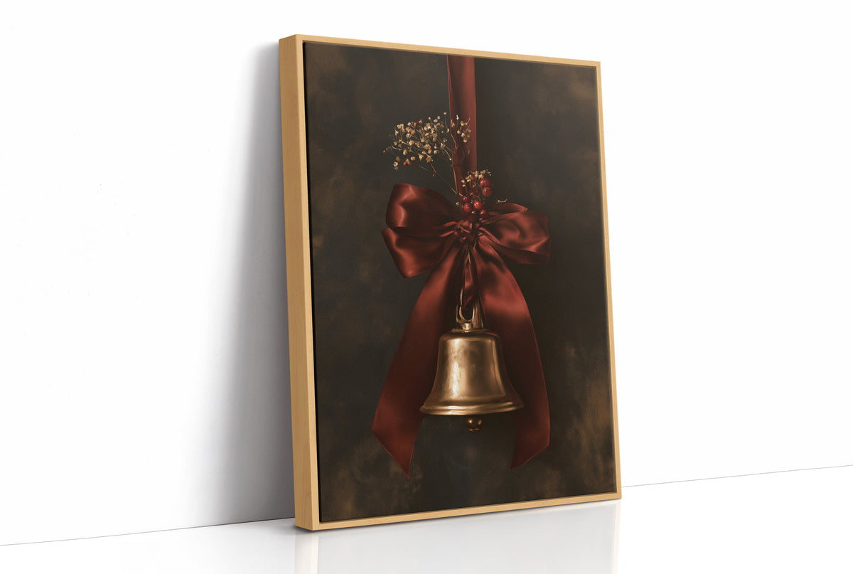 Bell Ringing for the Quiet Hour, a brass bell tied with a burgundy satin ribbon and dried sprigs, on a near black ground, as a framed canvas in a natural wood frame