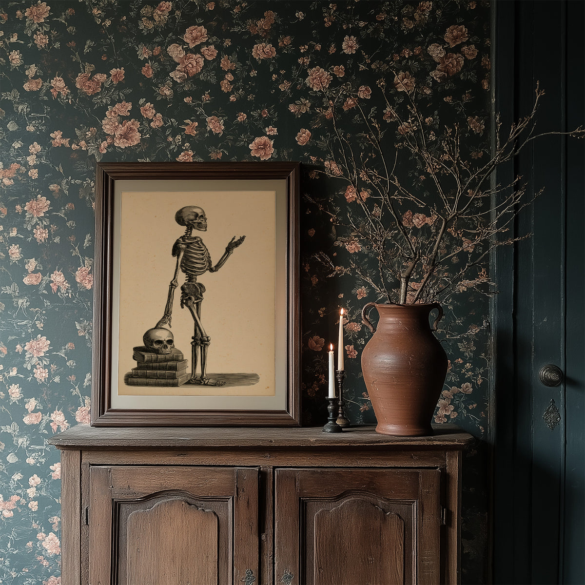Class Is Still in Session, vintage engraving style skeleton lecturing atop a stack of books and a skull on sepia paper, in a dark frame on a wooden dresser against floral wallpaper