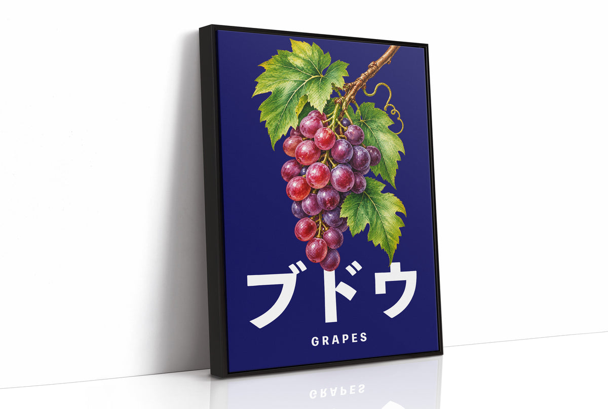 Clusters Heavy Over Midnight Water, a cluster of rose and purple grapes with green leaves hanging from a stem on a deep navy ground, with the Japanese katakana set in large white letters and the word GRAPES in small capitals beneath, as a framed canvas in a black frame