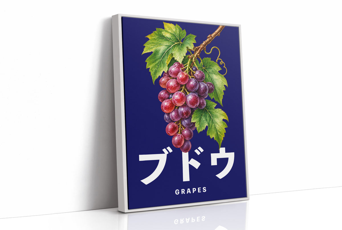 Clusters Heavy Over Midnight Water, a cluster of rose and purple grapes with green leaves hanging from a stem on a deep navy ground, with the Japanese katakana set in large white letters and the word GRAPES in small capitals beneath, as a framed canvas in a white frame