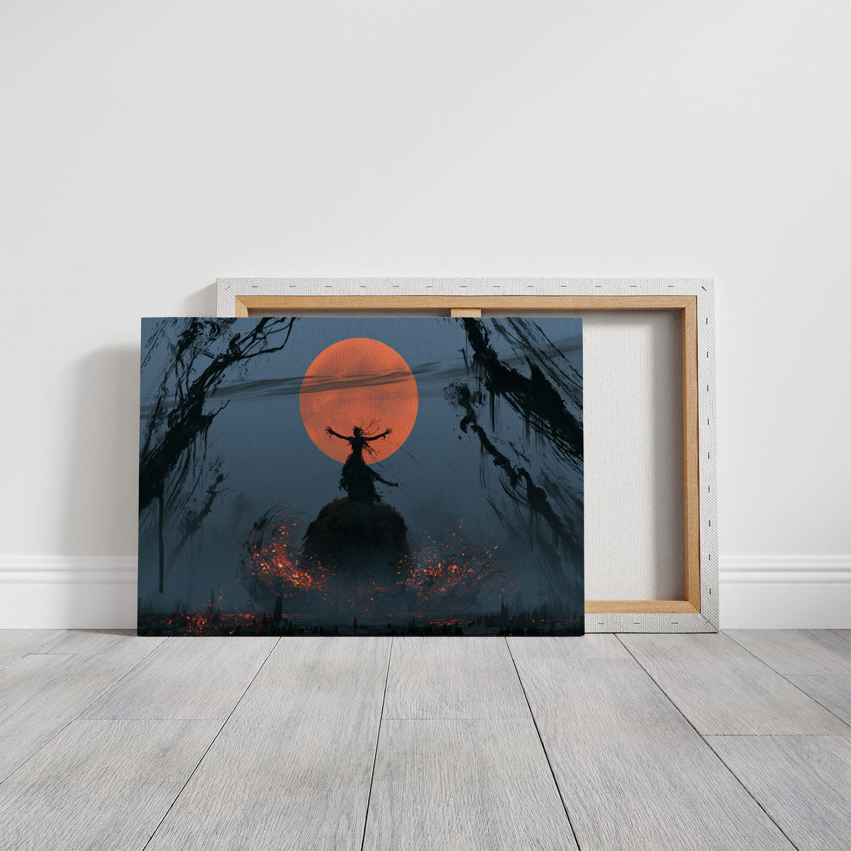 Embers at the Edge of Night, a dark witch silhouette on a hill before a huge orange moon, small fires glowing in the misty field below, on a gallery canvas with wrapped edges leaning against a white wall