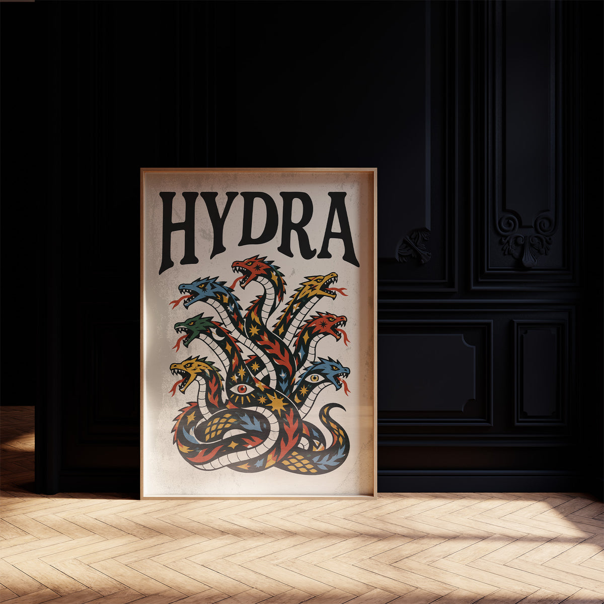 Every Head Grows Back Bolder, a many headed serpent with blue, red and gold scales rising in fans of heads, in a bold flash sheet style with a black lettered name across the top on a cream ground, in a dark frame on a black paneled wall above a sunlit herringbone floor