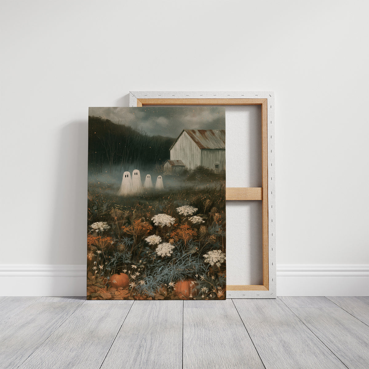Fog Settles on the Low Field, a dark barn on a hill above a meadow of cream and rust wildflowers, a pale mist in the valley and two faint pale figures at the edge of the field, painted in forest green, rust and bone, on a gallery canvas with wrapped edges leaning against a white wall