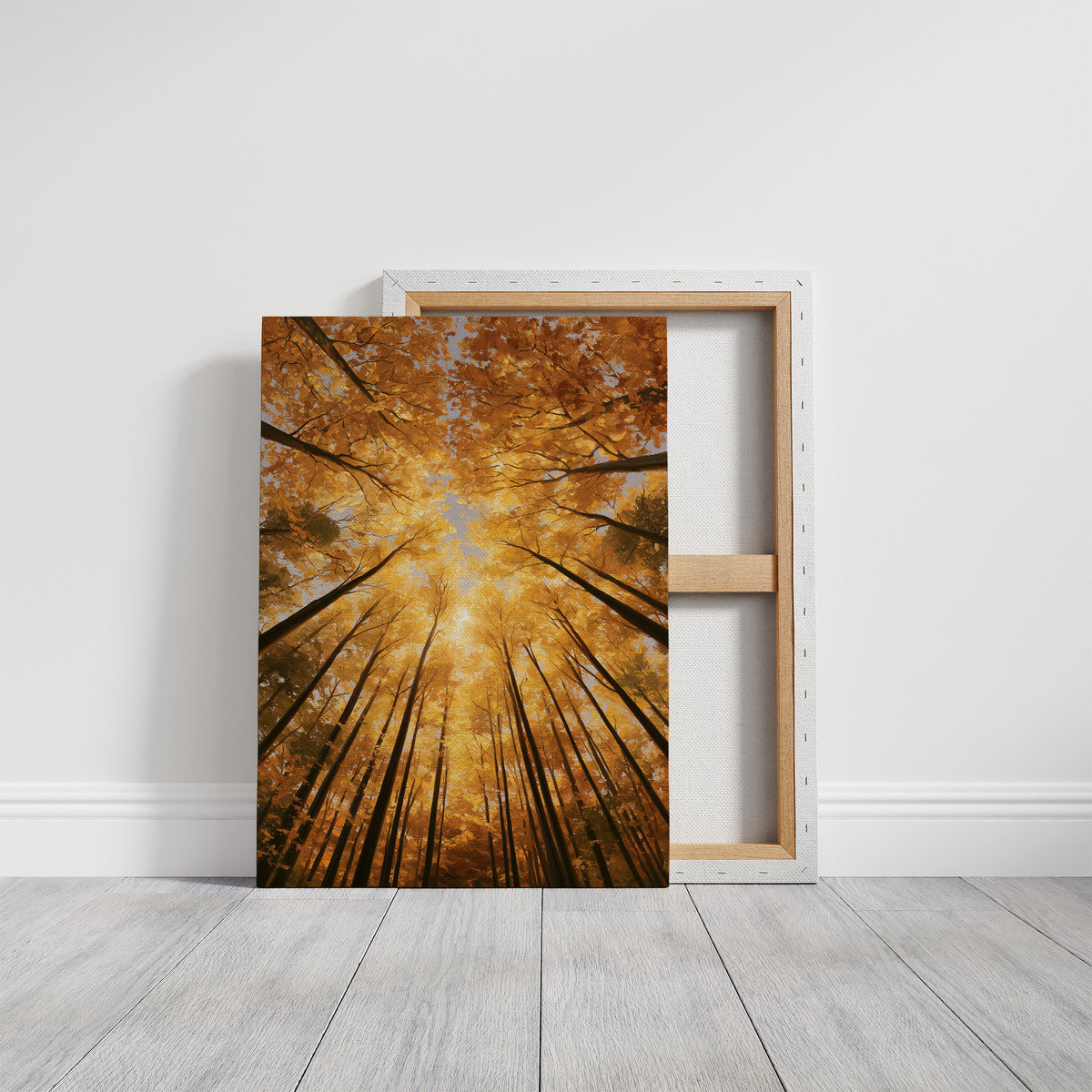 Gold Light Climbs the Tall Trees, a view straight up through tall forest trunks to a canopy lit gold from within, with shafts of warm light falling through the leaves, in amber, deep gold and forest brown, on a gallery canvas with wrapped edges leaning against a white wall