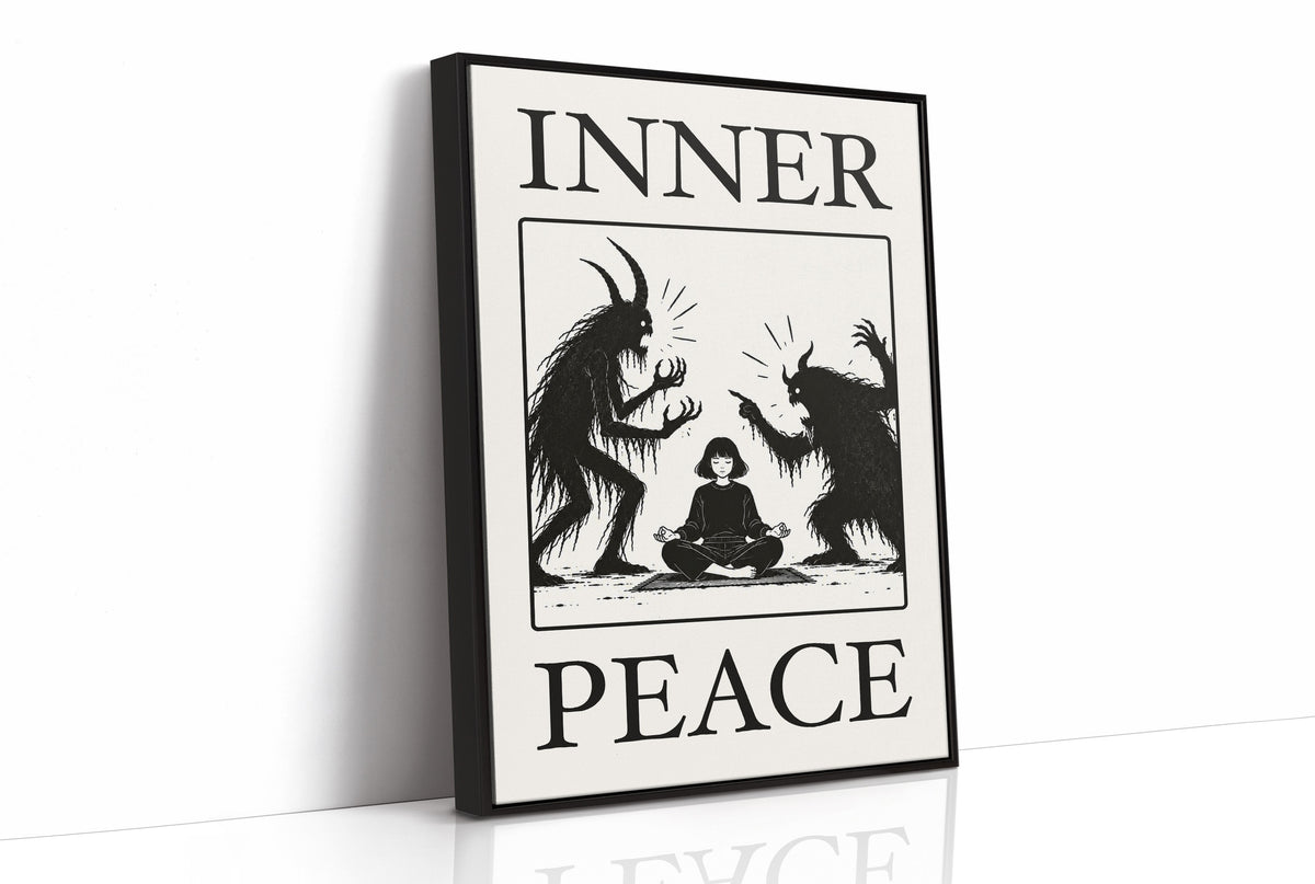 Inner Peace Has Company, two horned shadow figures in black flanking a small seated figure meditating at the base, cream ground in a black serif frame, with INNER above and PEACE below, as a framed canvas in a black frame