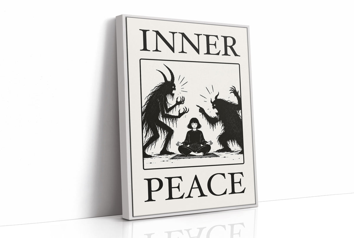 Inner Peace Has Company, two horned shadow figures in black flanking a small seated figure meditating at the base, cream ground in a black serif frame, with INNER above and PEACE below, as a framed canvas in a white frame