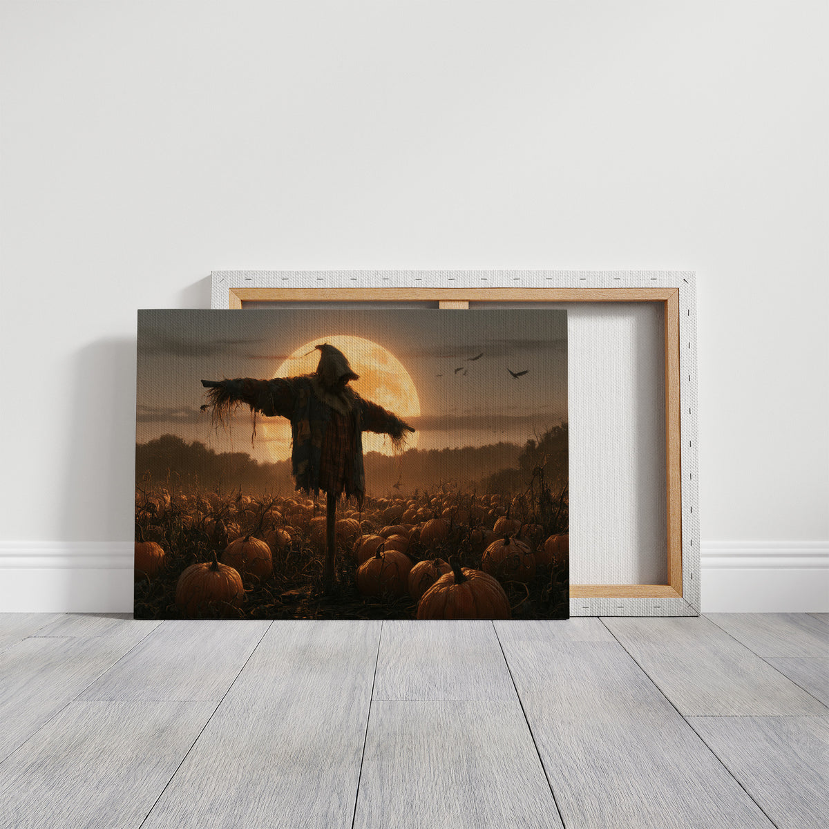 Keeping Watch Above the Pumpkins, a scarecrow standing in a pumpkin field beneath a huge rising moon, painted in deep amber and burnt orange, on a gallery canvas with wrapped edges leaning against a white wall