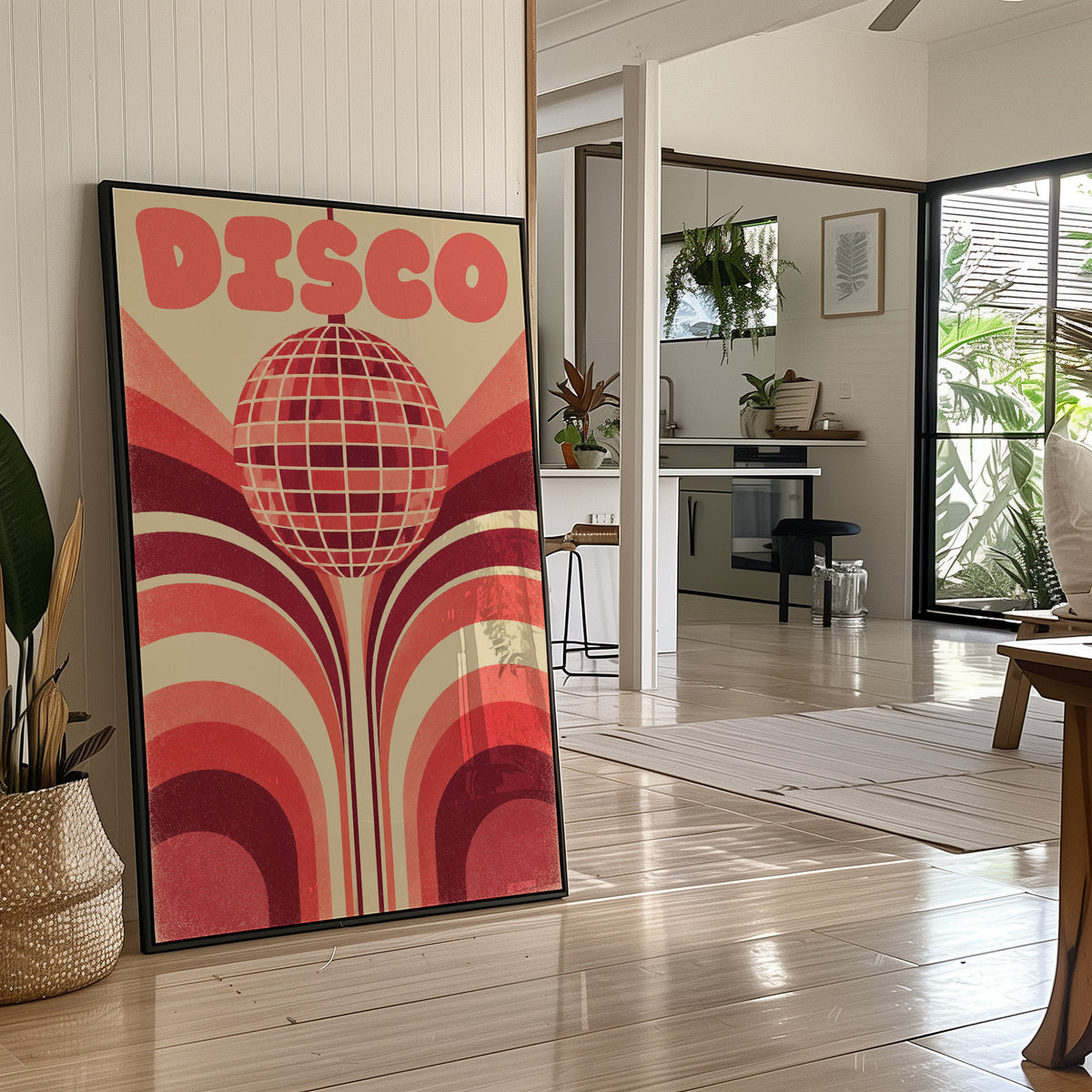 Rose Mirror Ball After Midnight, a retro disco ball drawn in a grid of rose and cream lines at the center of stacked arches in rose, cream and oxblood, with the word DISCO in bold rose letters across the top, in a black frame leaning on a bright hallway floor beside a potted plant