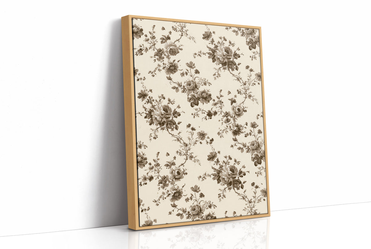 Roses Keep to the Linen, a repeating vintage pattern of brown roses and leafy sprigs on a cream ground, as a framed canvas in a natural wood frame