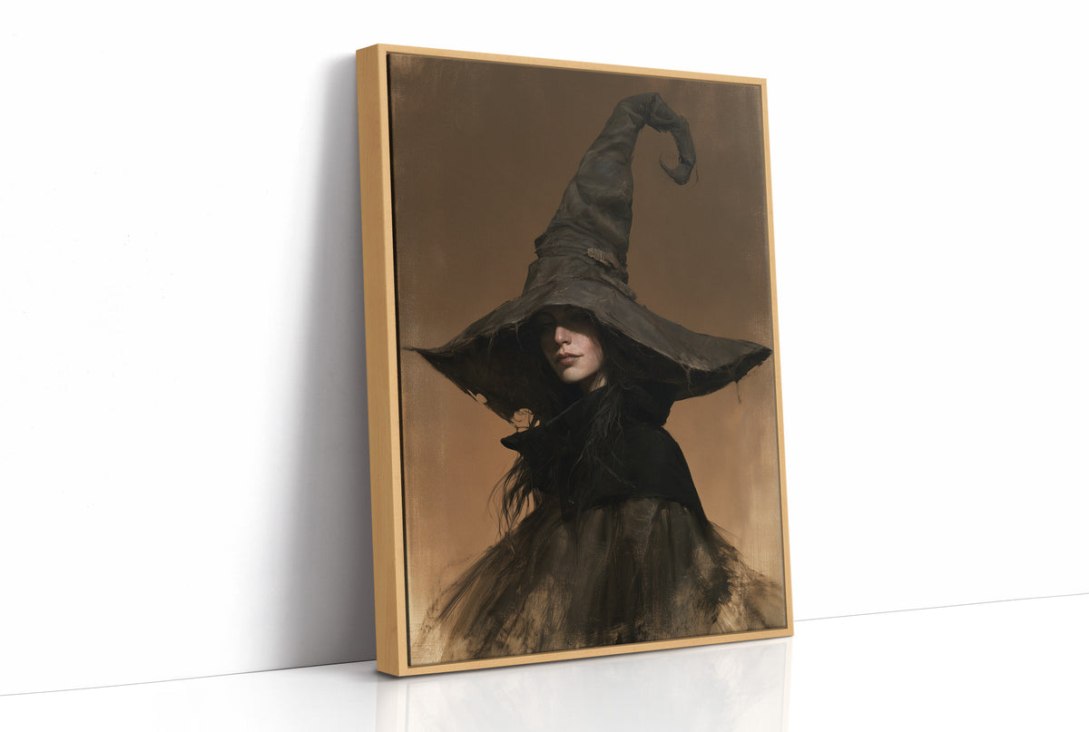 She Keeps Her Own Counsel, a dark witch in a tall pointed hat and a cloak, in a sepia portrait with a gilt frame, as a framed canvas in a natural wood frame