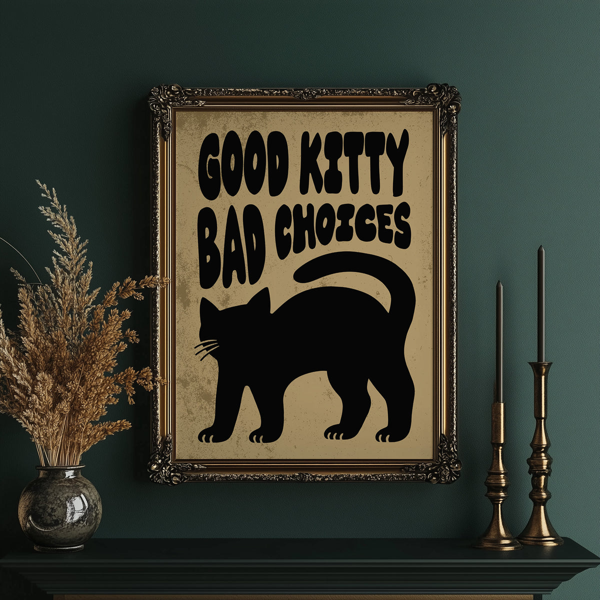 Sleek Silhouette, Questionable Taste, a solid black cat silhouette with a long tail curled up the side, standing on tan paper with the words GOOD KITTY BAD CHOICES in bold black lettering, in an ornate gold frame on a deep green wall beside tall brass candlesticks