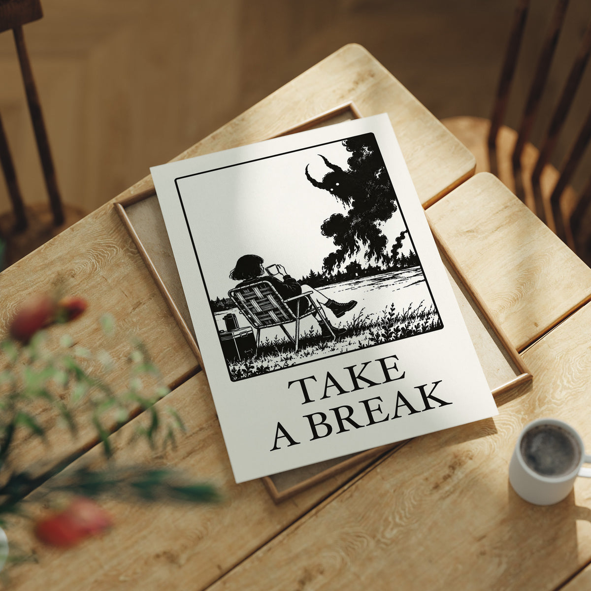 The Break Nobody Schedules, a figure in a deck chair under a broad tree in a black and cream line scene, with TAKE A BREAK in large serif capitals beneath, lying flat on a light wood table beside a coffee cup and red berries
