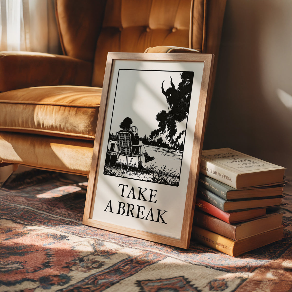 The Break Nobody Schedules, a figure in a deck chair under a broad tree in a black and cream line scene, with TAKE A BREAK in large serif capitals beneath, in a wood frame on a rug beside a leather armchair and a stack of books