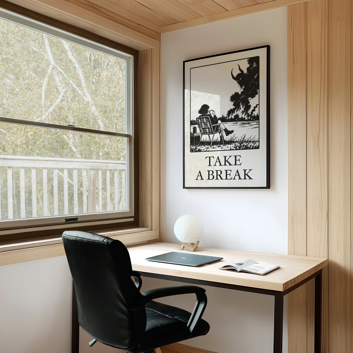 The Break Nobody Schedules, a figure in a deck chair under a broad tree in a black and cream line scene, with TAKE A BREAK in large serif capitals beneath, on a study wall above a writing desk and a black desk chair