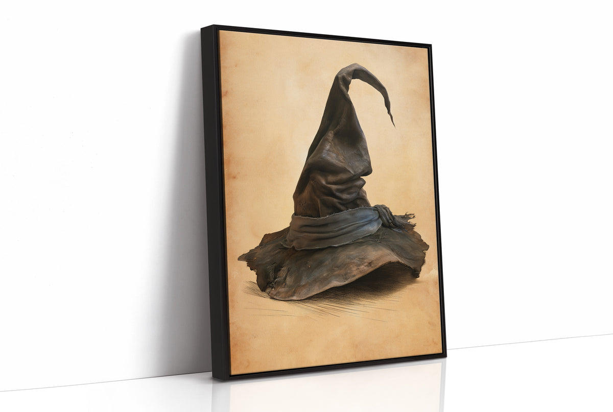 The Hat Left by the Door, a single pointed witch hat with a soft bend at the tip, sitting on a worn cream ground, painted in charcoal, brown and tan, as a framed canvas in a black frame