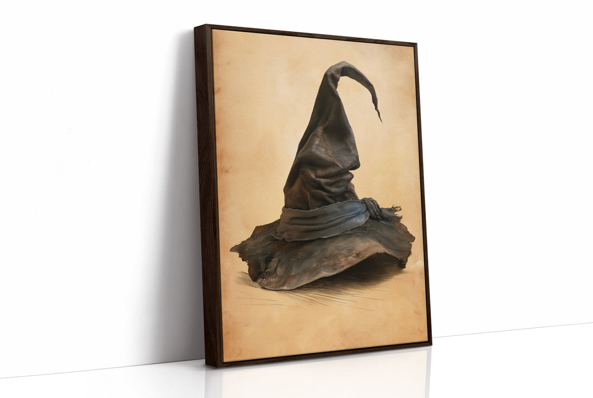 The Hat Left by the Door, a single pointed witch hat with a soft bend at the tip, sitting on a worn cream ground, painted in charcoal, brown and tan, as a framed canvas in a brown frame