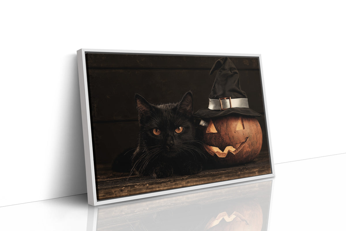 The Keeper of Lantern Night, a black cat beside a glowing carved pumpkin wearing a witch hat, painted in deep brown, burnt orange and candle gold, as a framed canvas in a white frame