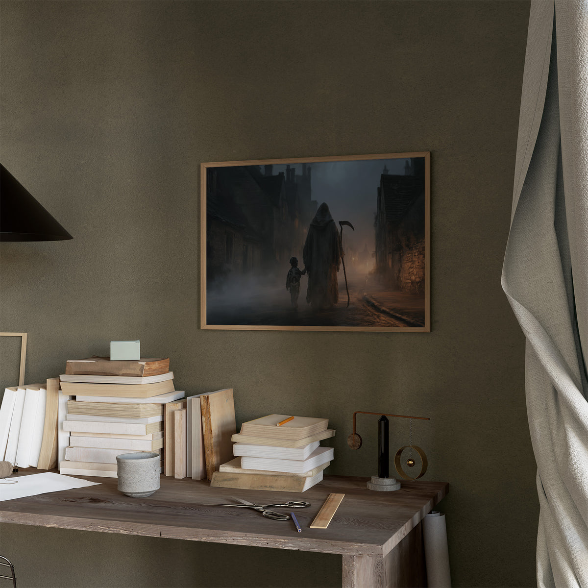 The Lantern Walk Home, hooded figure with a scythe walking a foggy cobbled street beside a child holding a lantern painting, in a thin wood frame on a moss green wall above a desk stacked with books