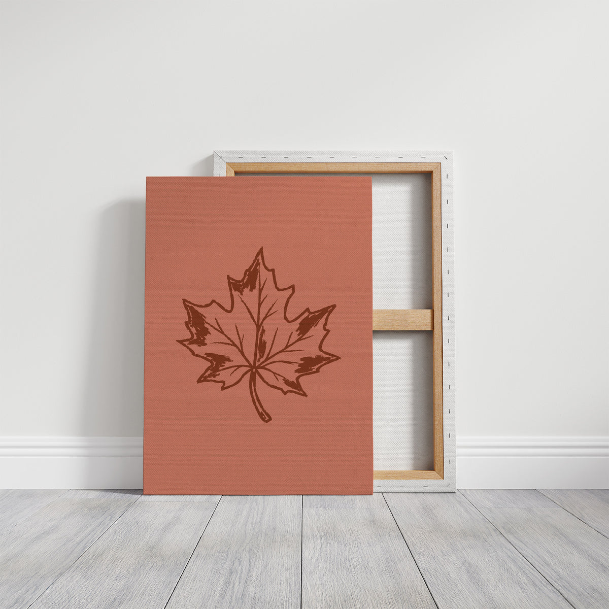 The Maple Keeps Its Last Light, a single maple leaf drawn in fine brown outline on a dusty terracotta ground, a botanical line study with soft shading, on a gallery canvas with wrapped edges leaning against a white wall