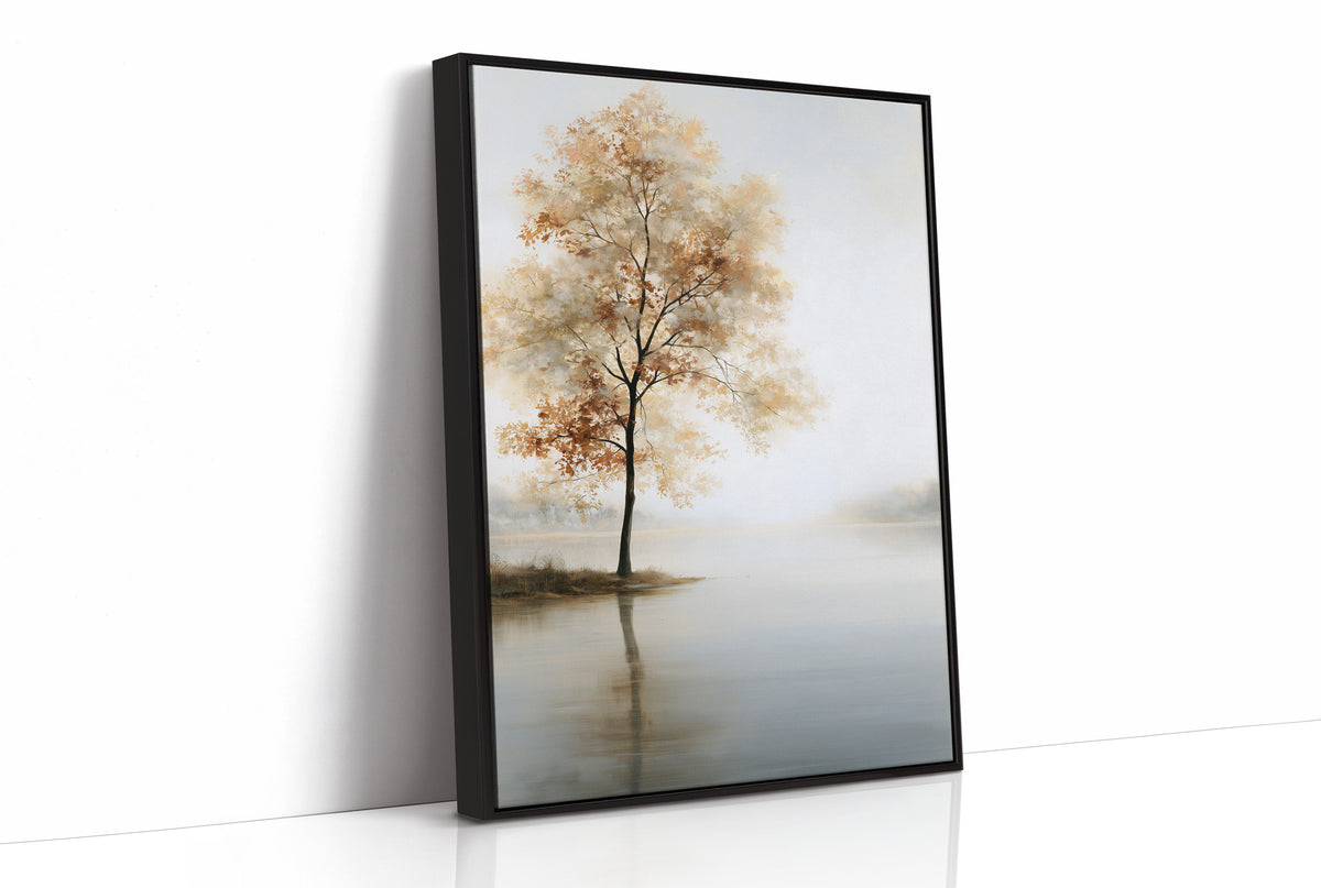 The Tree Stays Put in the Mist, a single tree with autumn gold in its crown standing on the edge of a pale lake, with the mist rolling low over the water and the sky a soft cream and blue, as a framed canvas in a black frame