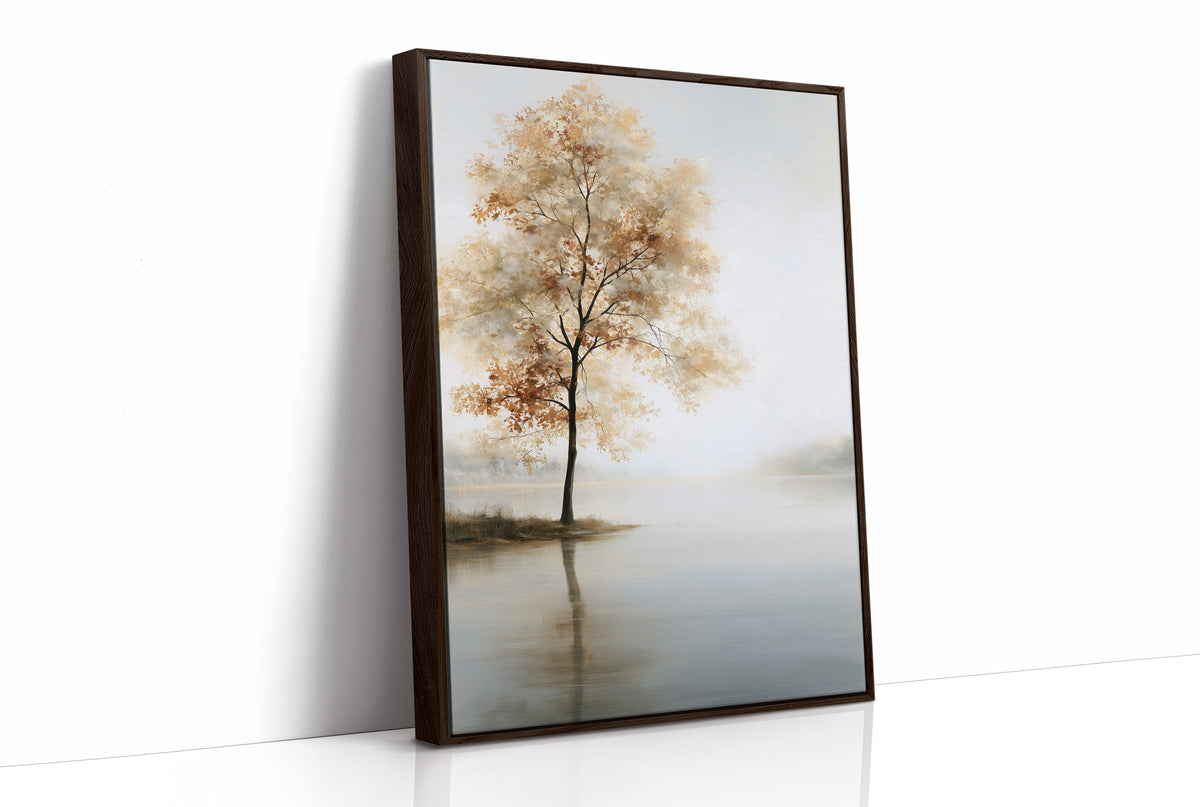 The Tree Stays Put in the Mist, a single tree with autumn gold in its crown standing on the edge of a pale lake, with the mist rolling low over the water and the sky a soft cream and blue, as a framed canvas in a brown frame