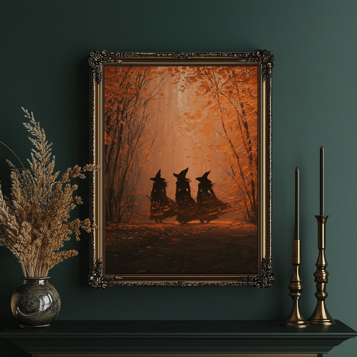Three Sisters in the Amber Wood, three witch silhouettes standing together in a glowing autumn forest of orange haze and deep umber shadows, painted in burnt orange, umber and soft rust, in an ornate gold frame on a deep green wall beside brass candlesticks