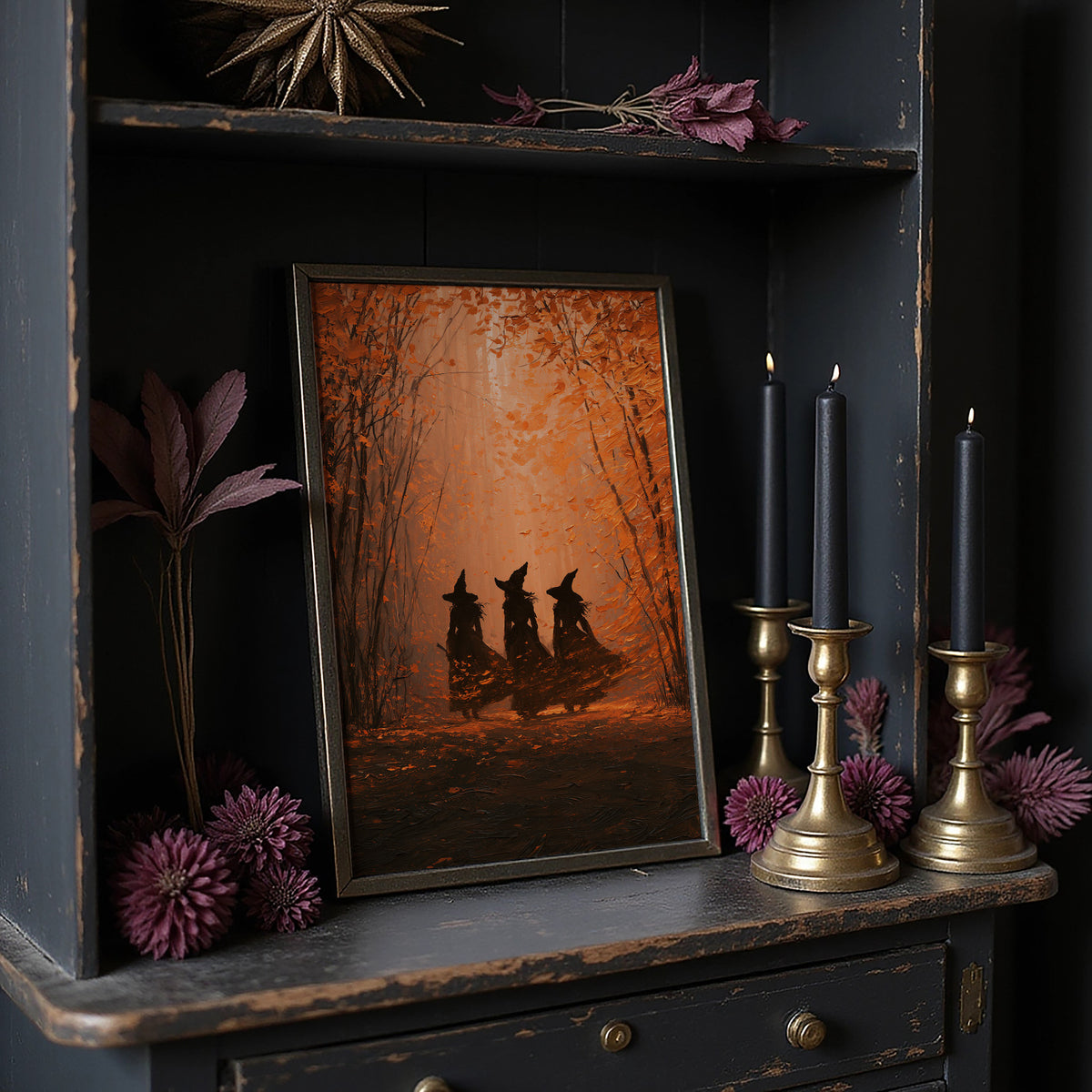 Three Sisters in the Amber Wood, three witch silhouettes standing together in a glowing autumn forest of orange haze and deep umber shadows, painted in burnt orange, umber and soft rust, on a dark wooden cabinet shelf with candles and dried flowers