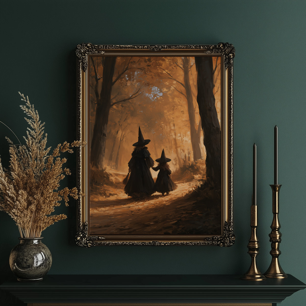 Two Witches on the Amber Path, two witch silhouettes walking a forest path between tall trees, glowing haze and a pale starry cluster above, painted in amber, umber and deep shadow, in an ornate gold frame on a deep green wall beside brass candlesticks