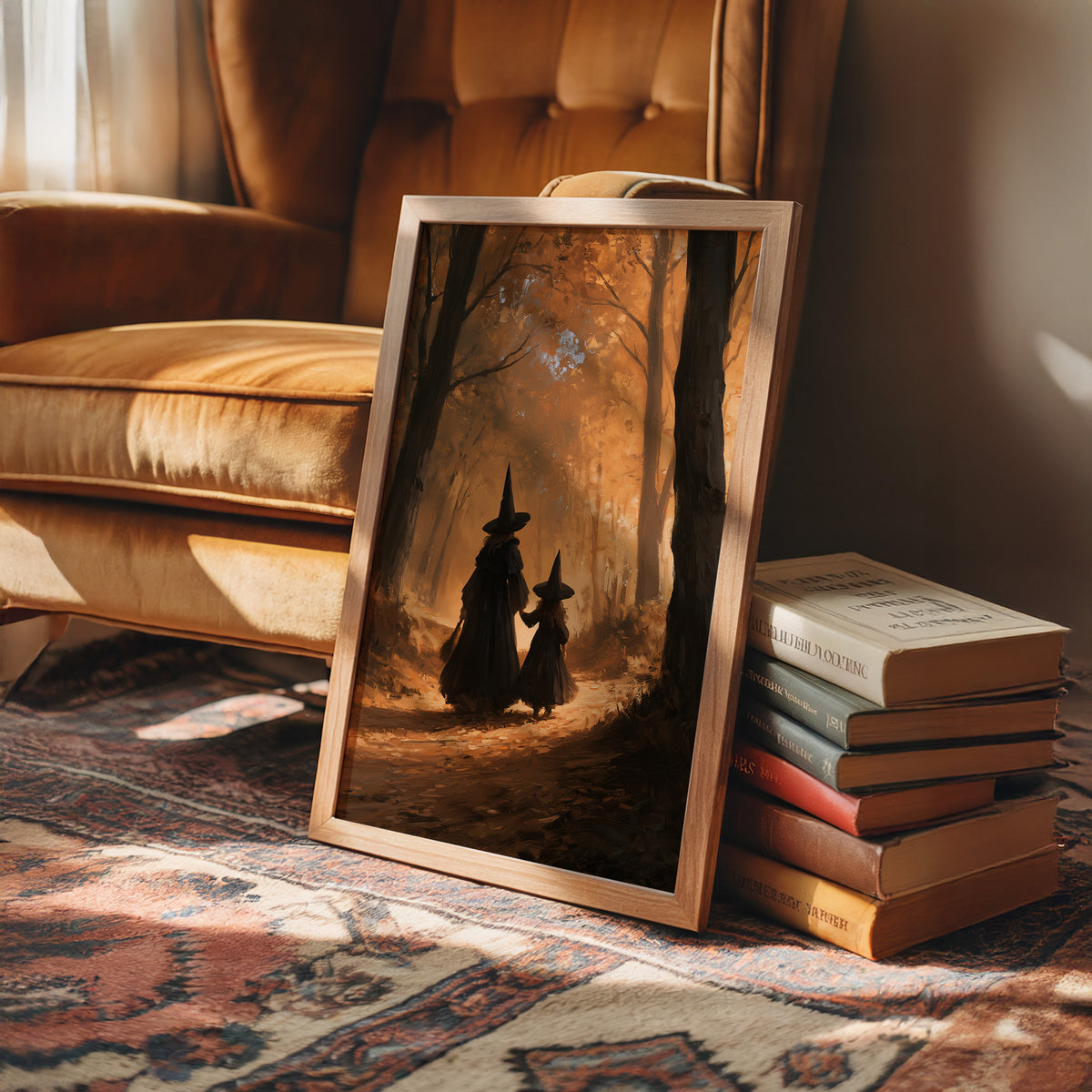 Two Witches on the Amber Path, two witch silhouettes walking a forest path between tall trees, glowing haze and a pale starry cluster above, painted in amber, umber and deep shadow, in a wood frame beside a leather armchair and a stack of books