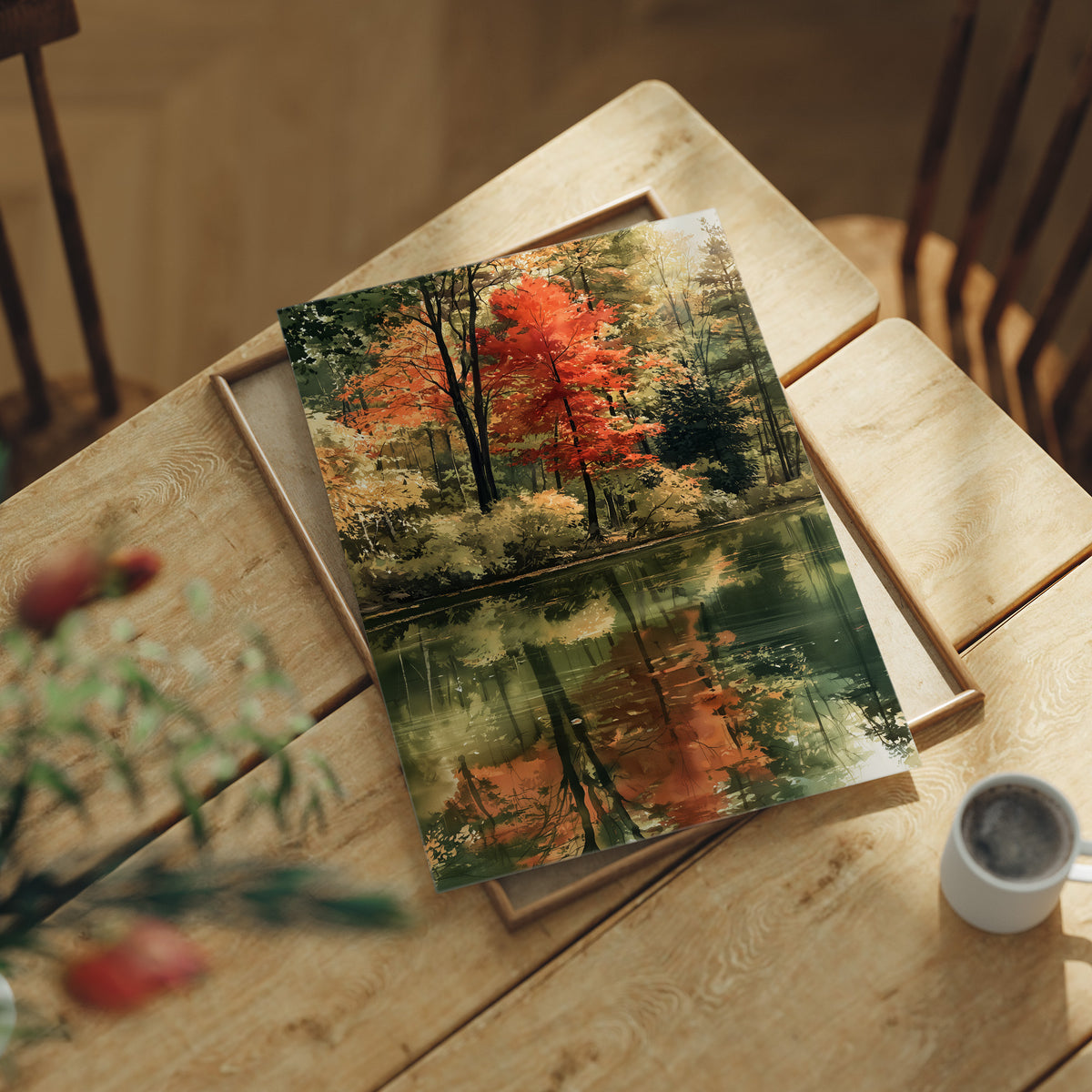 Mirror Mirror On The Pond, print laid on a wooden table beside a white mug and flowers