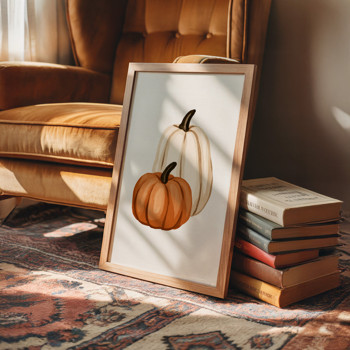 Short Stack, Long Shadow, framed print leaning on a leather armchair beside a stack of books