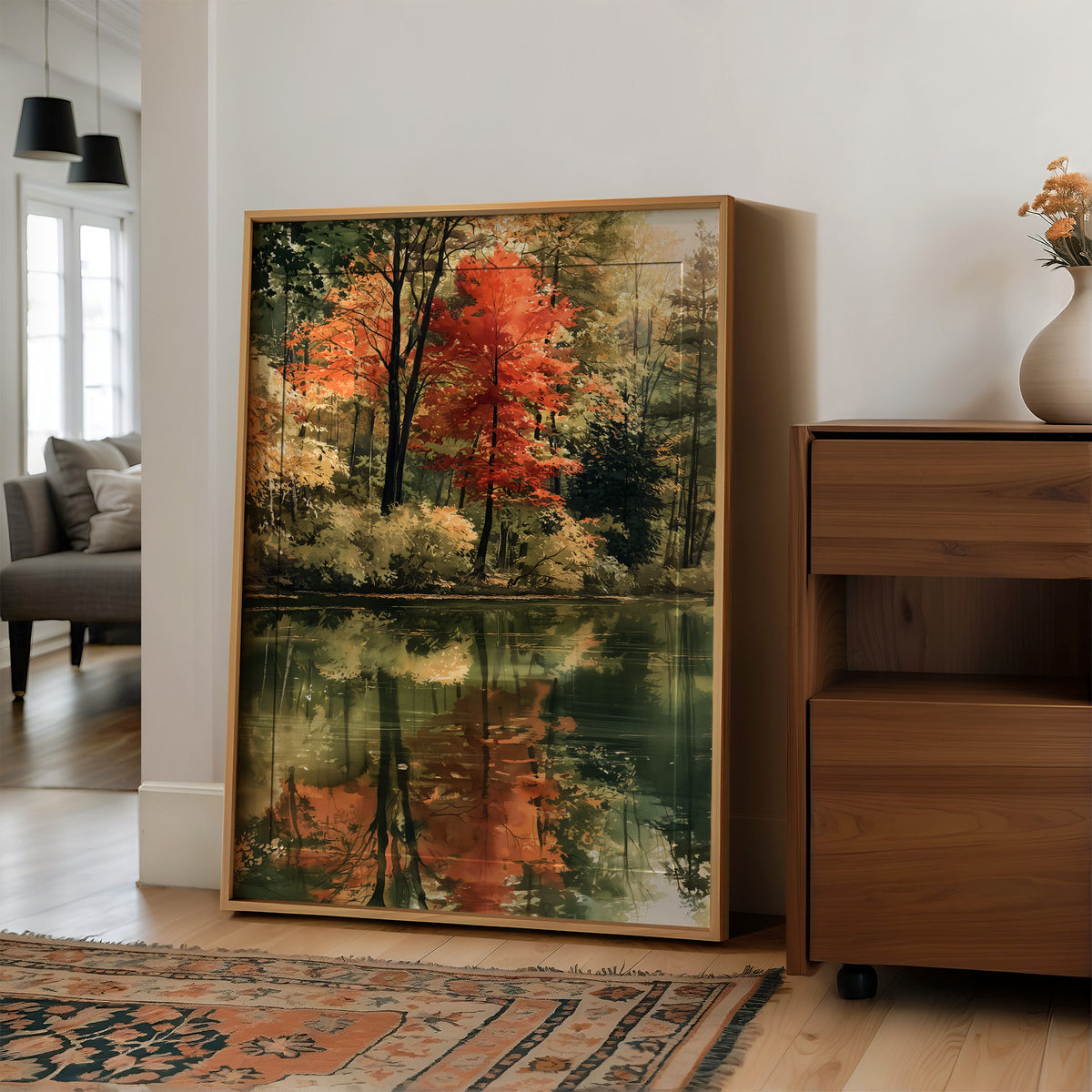 Mirror Mirror On The Pond, large framed print leaning on a white wall beside a wood cabinet