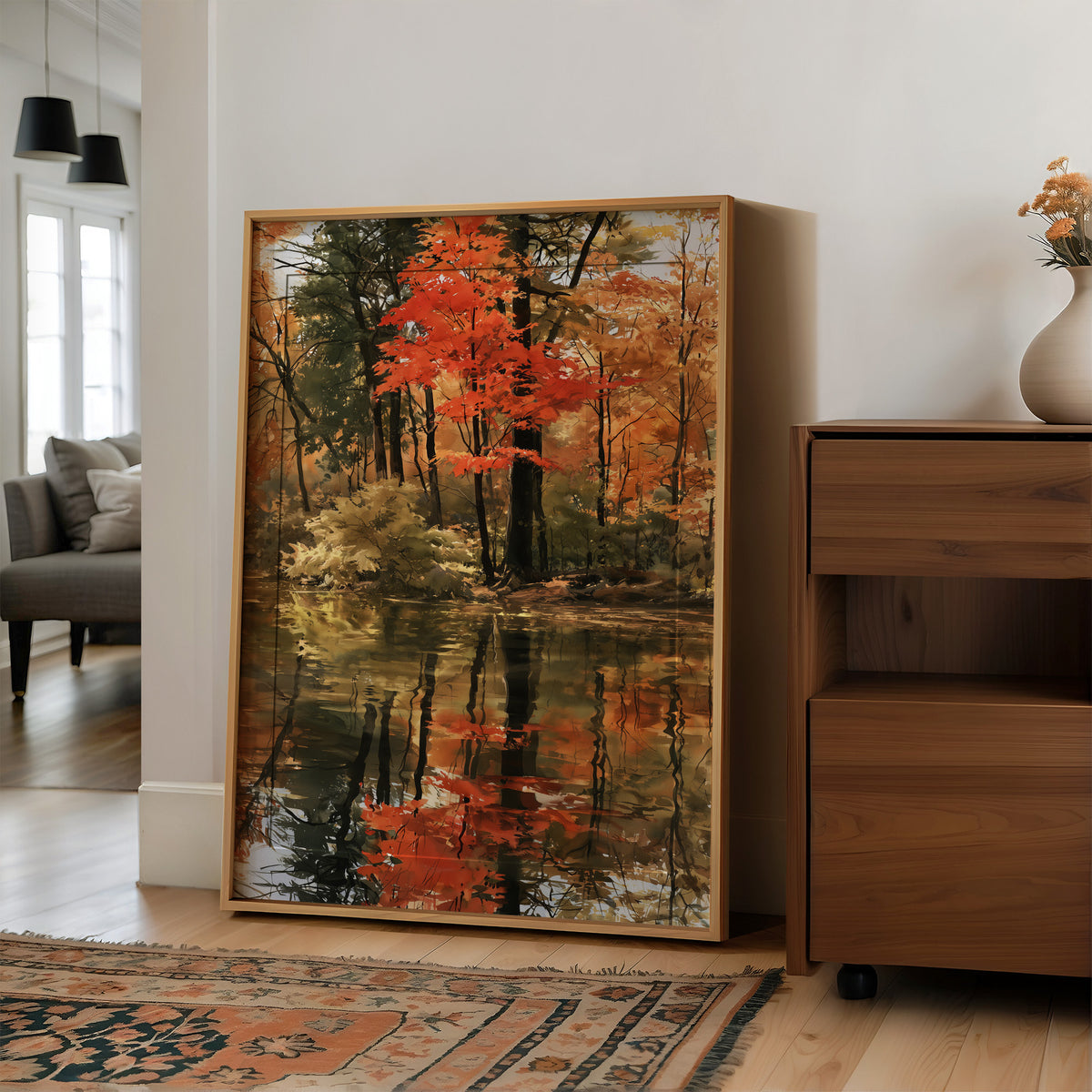 Seeing Red, Reflecting Well, large framed print leaning on a white wall beside a wood cabinet