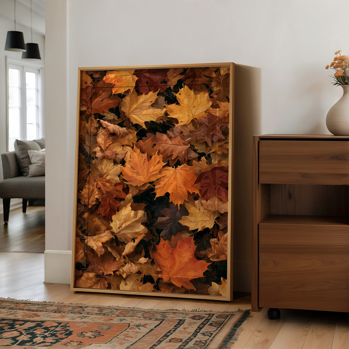 Leaf Me Alone, I’m Resting, large framed print leaning on a white wall beside a wood cabinet