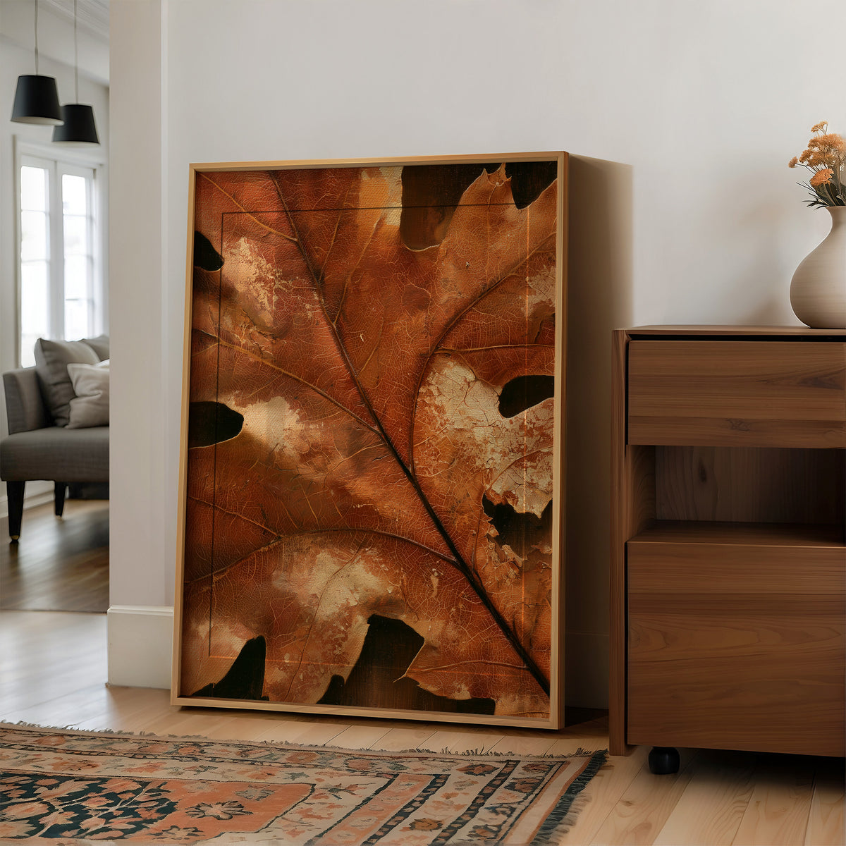 Vein Glory, large framed print leaning on a white wall beside a wood cabinet