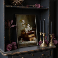 Blossoms Rest On Vintage Tomes