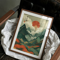 Red Sun Rises Over Misty Peaks