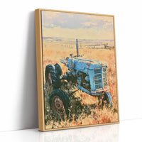 Old Blue: Sun-Kissed Tractor in the Prairie Grass