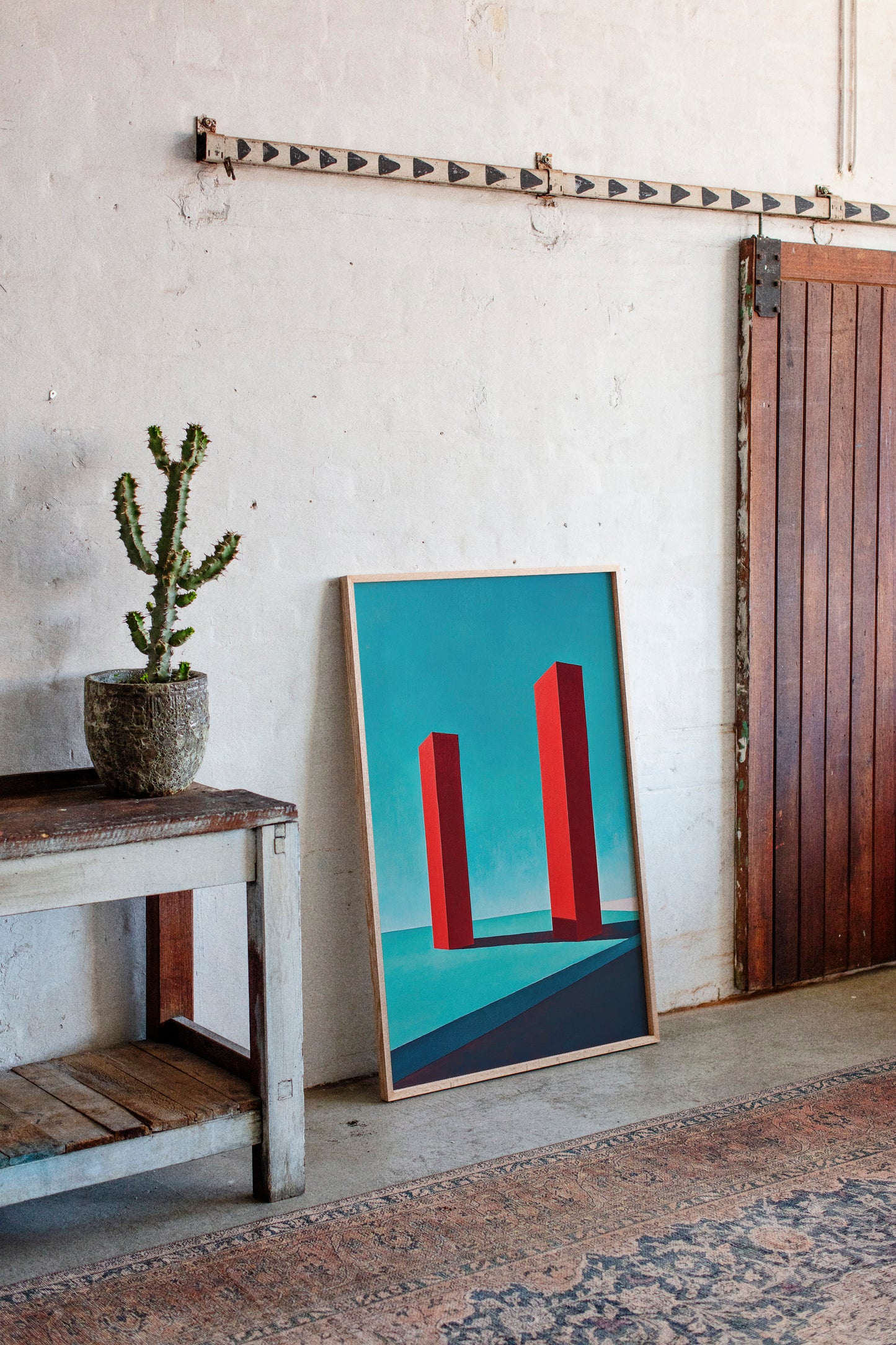 Red Pillars Against Turquoise Sky
