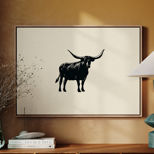 longhorn silhouette on a canvas hanging on tan wall