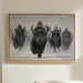 Person in a white robe standing in a modern living room with a framed artwork of four bison on the wall.