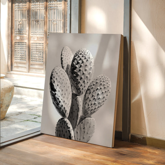 Decorative painting of a cactus on a wooden floor with a glass door in the background