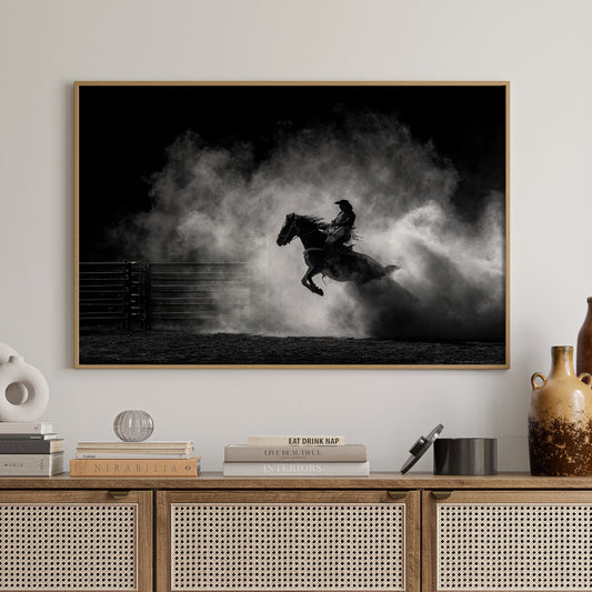 Wooden cabinet with decorative items and a framed black and white artwork of a horse on a wall.